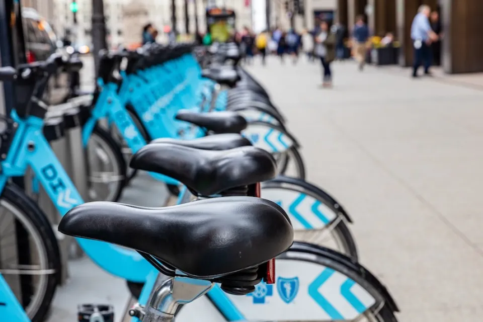 Close-up of town of blue Divvy bike share bikes parked at station in Chicago, Illinois.
